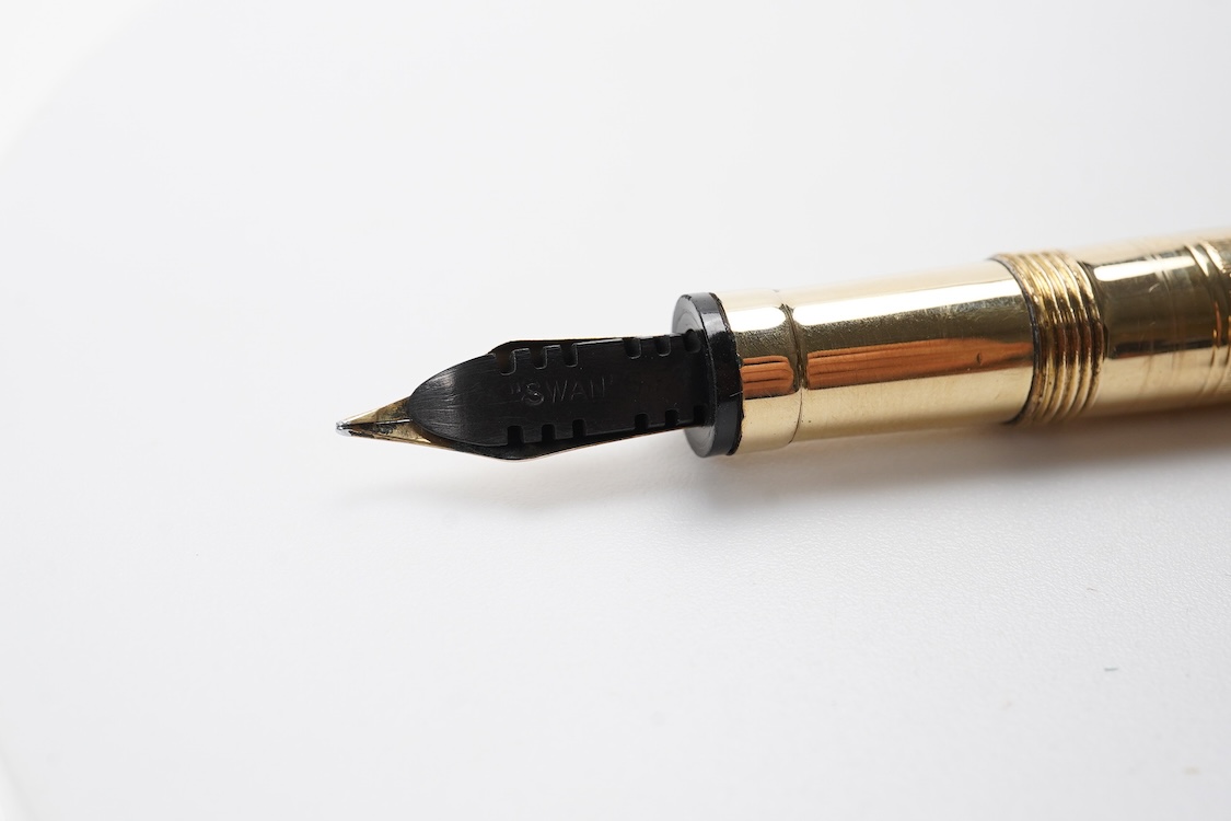 A Mabie Todd & Co. Swan gold filled lever filler, Made in USA with No.2 14ct. flexible nib